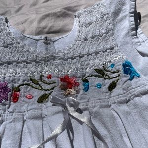 Size 4 white baby doll top with floral design and see through bottom half